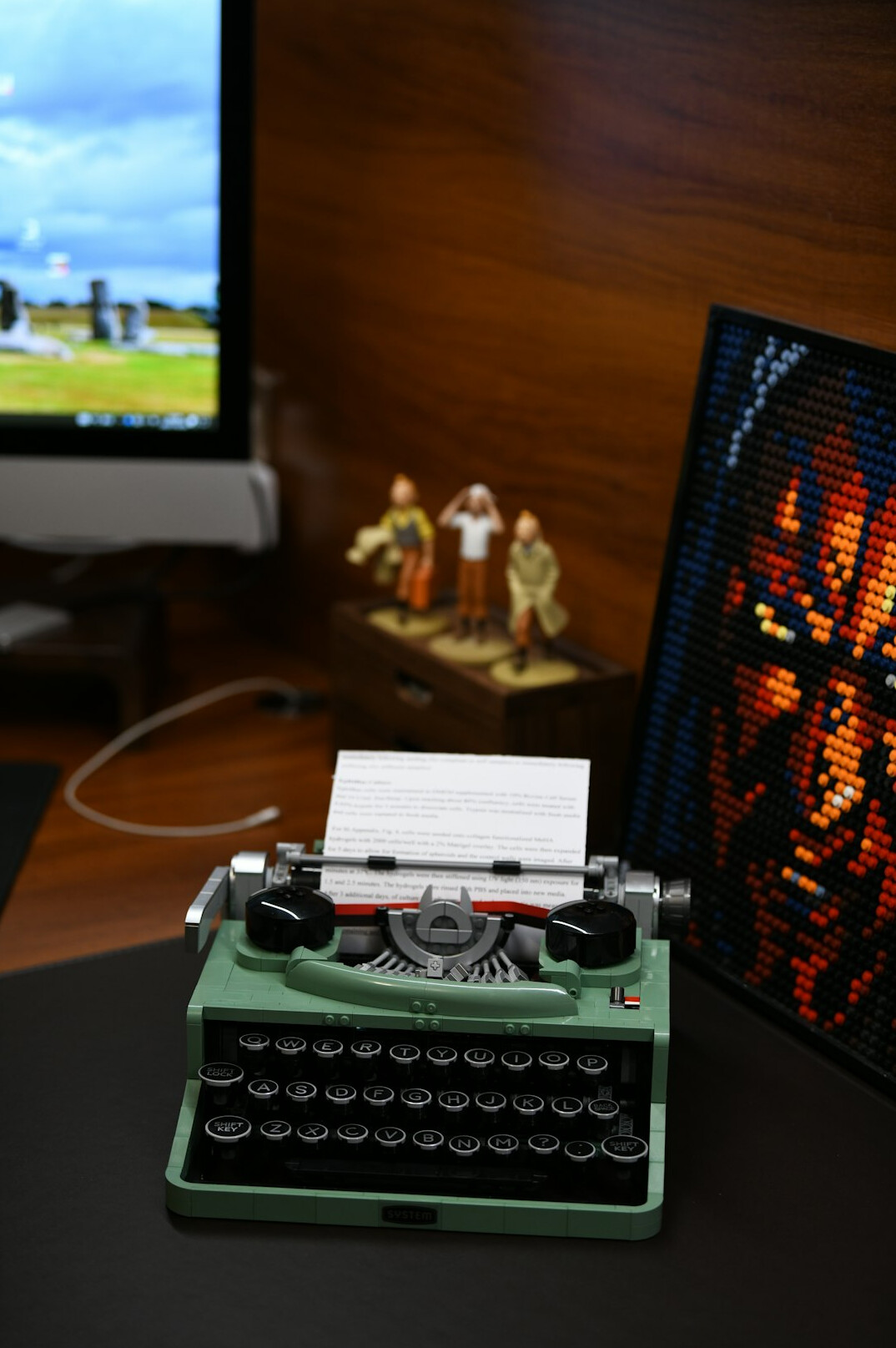 Vintage typewriter and notebook on a wooden desk