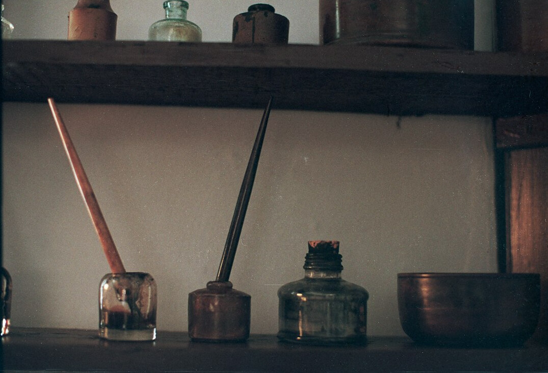 Old handwritten letters and a fountain pen on a desk